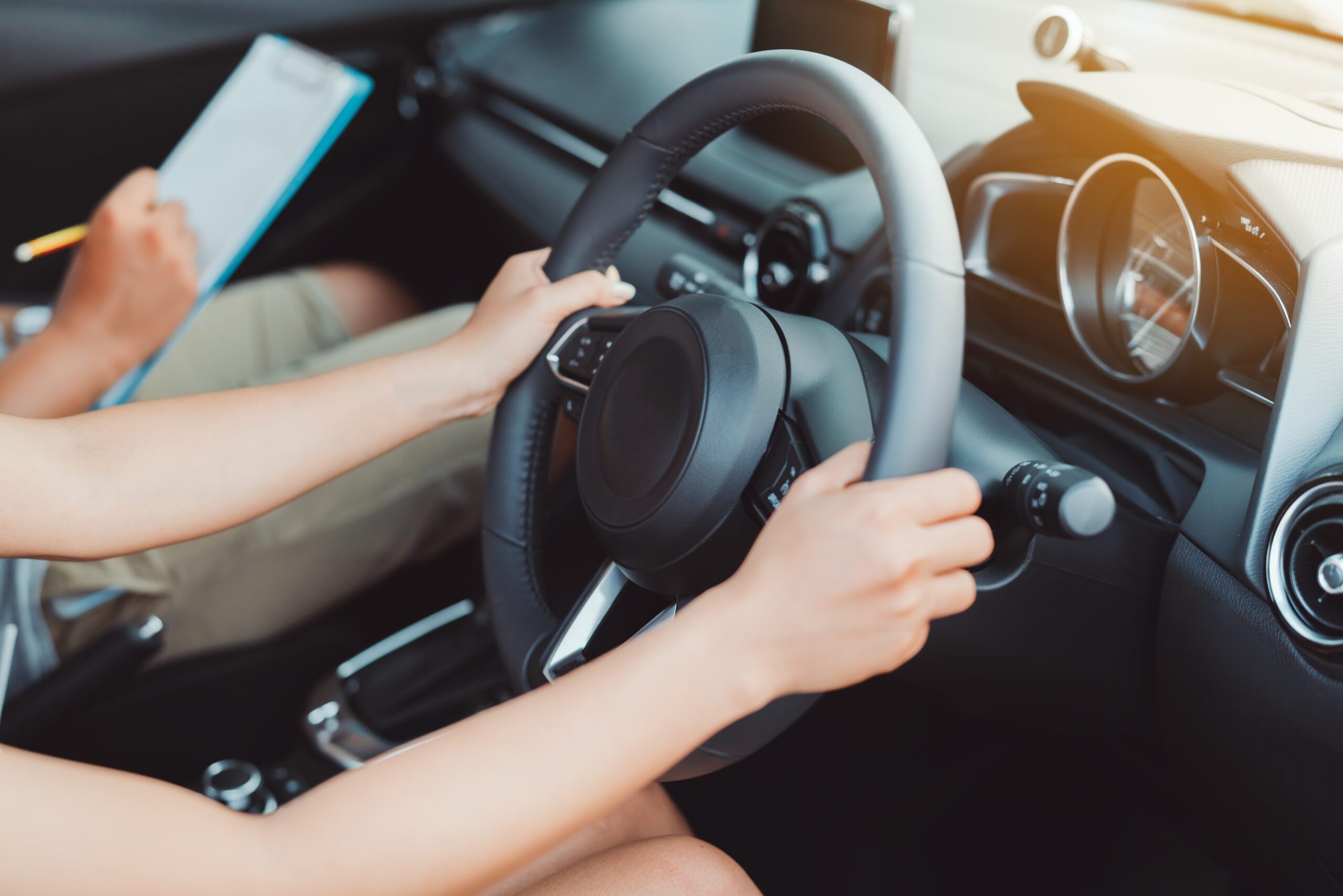 Woman practice driving car exam driver licence control steering wheel education and learn on street road by driving instructor teaching at school drive transportation safety travel, people lifestyle automatic driving lessons