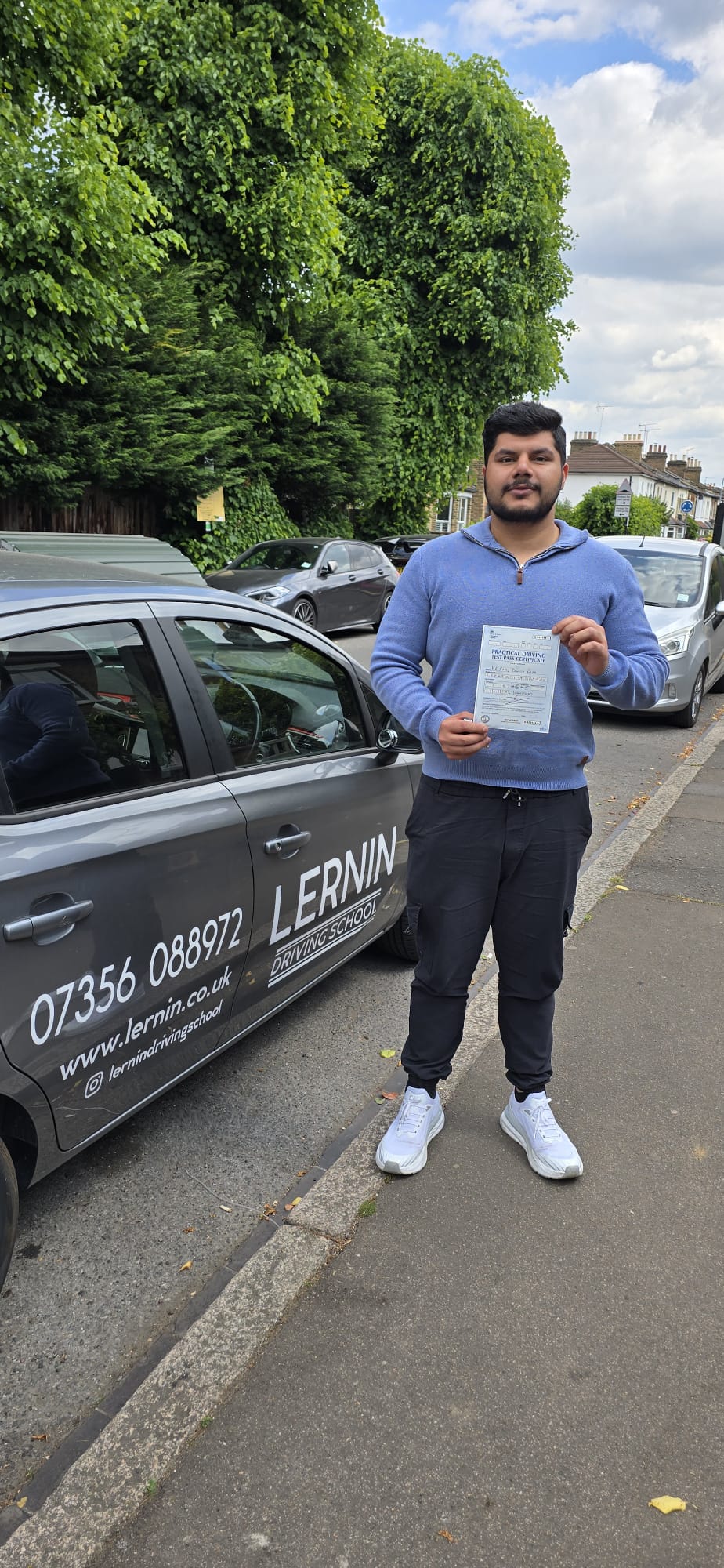 First-time pass at Wanstead Test Centre with Danish, holding their driving test pass certificate. driving lessons chingford