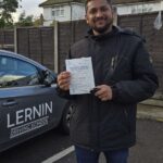 Nitheesh with his practical pass certificate at Loughton Driving Test Centre.